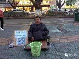 chinese beggar with a QR code
