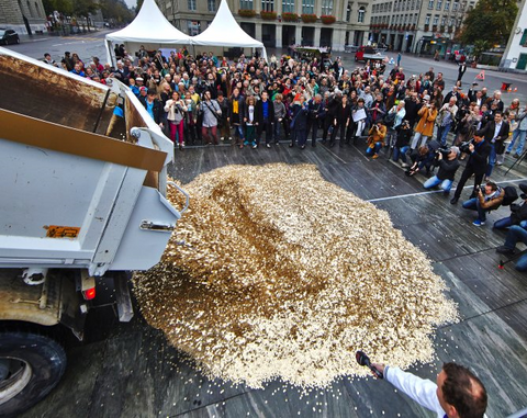 unconditional basic income - referendum in switzerland - 8 million coins dumped before parliament